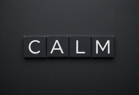 This minimalist image features the word "Calm" in bold, white font against a dark background, embodying serenity and relaxation ideal for wellness or mindfulness themes.の素材