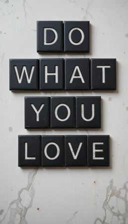 This artistic arrangement of black tiles spelling "Do What You Love" on a marble surface offers a motivational touch for any space, promoting positivity and creativity.の素材