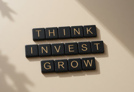 The image features black letters spelling out "Think, Invest, Grow" on a neutral background, symbolizing motivation and personal development for success.の素材