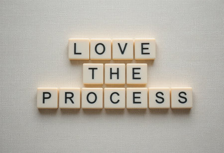 This image showcases an inspiring arrangement of tiles spelling "Love the Process." Ideal for motivational content, it highlights positivity and personal growth.の素材