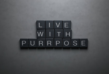 A striking arrangement of black blocks featuring the motivational phrase "Live with Purpose," ideal for inspirational content and creative designs.の素材