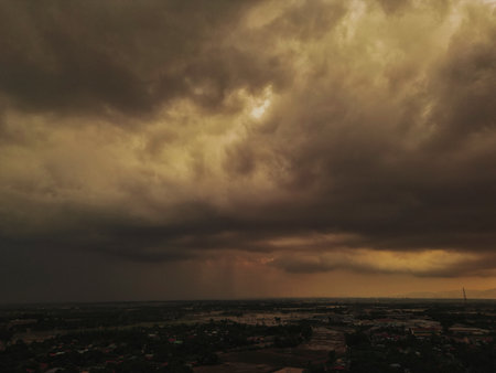 Scenic outdoor view capturing natural elements like sunset, sunrise, fog, paddy field, and cloud formations. Suitable for nature, travel, or weather-related themes.の写真素材