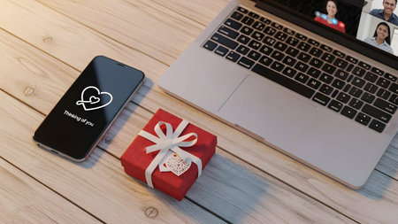 Valentine's day concept with smartphone and gift box on wooden tableの素材