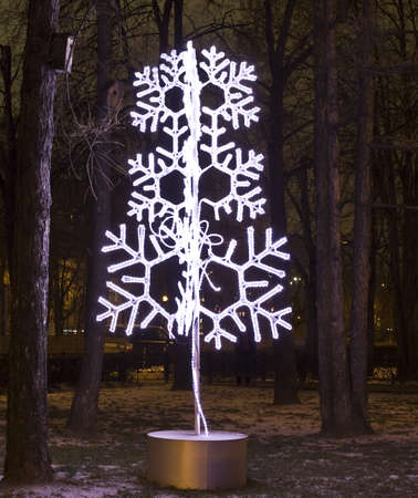 Street christmas decoration - white Christmas tree, recorded in Moscow, Pushkinskaya square, December 2011.のeditorial素材