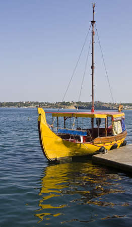 Yellow retro touristic boat. Recorded in town Sevastopol in region Crimea on Black sea.