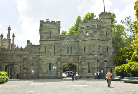 Alupka, Crimea, Ukraine - May 25, 2012: tourists enter gates to Vorontcovskiy palace in town Alupka in region Crimea in Ukraine. Palace was built for earl Vorontcov in 19 century.のeditorial素材