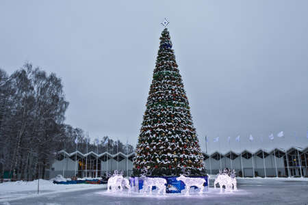 Moscow, Russia - January 02, 2012: Christmas tree and electric sculptures of deers, recorded in Sokolniki park.のeditorial素材