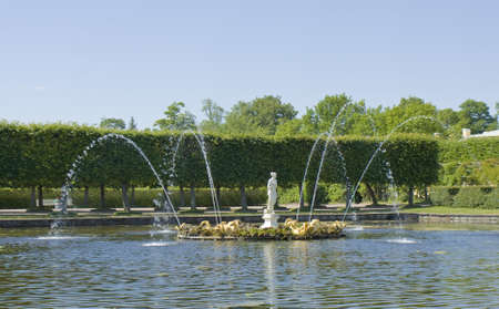 Peterhof, Russia - July 06, 2012: Square fountain in park near king's palace in Peterhof, surroundings of St. Petersburg. のeditorial素材