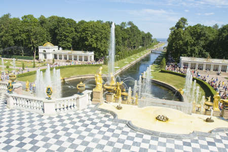 Peterhof, Russia - July 06, 2012: fountain grand-cascade near king's palace in Peterhof, surroundings of St. Petersburg, unidentified people tourists visiting the place.のeditorial素材