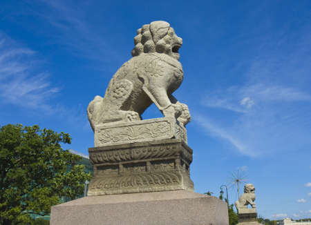 St. Petersburg, Russia - July 03, 2012: Chinese (Manchurian) sculptures Shih Tzu on Petrovskaya quay of river Neva on Zayachiy (Hare's) island.のeditorial素材