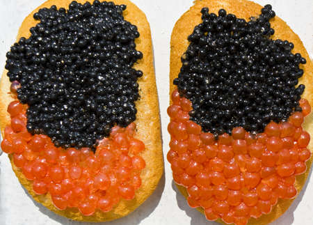 Two sandviches with red and black caviar.の写真素材