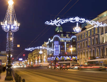 St. Petersburg, Russia - December 24, 2012: Nevskiy prospectus - main street of the city at night with illumination to Christmas and New year holidays and house of company のeditorial素材