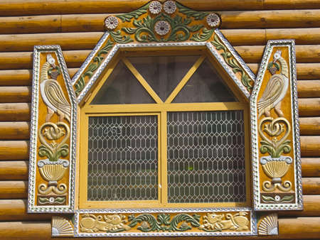 Moscow, Russia - May 02, 2008: Wooden window with handmade decoration, detail of wooden palace in Izmaylovskiy vernisage, complex of wooden architecture in Moscow.のeditorial素材