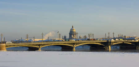 St. Petersburg, cathedral of St. Isaak and Palace bridge on river Neva in winter.の写真素材