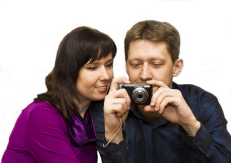 Young man and woman European with compact photocamera, isolated.の写真素材