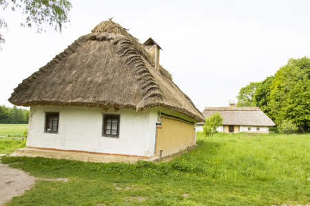 Traditional Ukrainian village house, recorded in outdoors museum of wooden architecture in village Pirogovo near Kiev, capital of Ukraine.のeditorial素材
