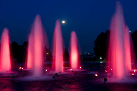 Illuminated fountains in historical complex Poklonnaya hill on Kutuzovskiy prospectus avenue at night in Moscow.のeditorial素材