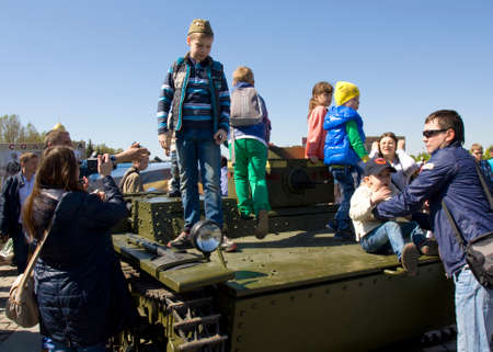MOSCOW - MAY 9, 2014  Holiday Victory Day devoted to victory in Second World War, children play on exhibition of vintage military technique on memorial Poklonnaya hill のeditorial素材