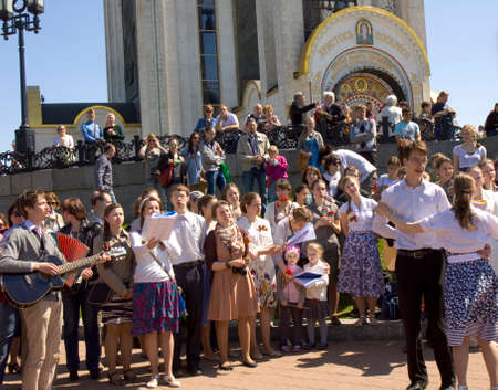 MOSCOW - MAY 9, 2014  Holiday Victory Day devoted to victory in Second World War, people dancing on the street and singing war songs near church of Saint George on memorial Poklonnaya hill 	のeditorial素材