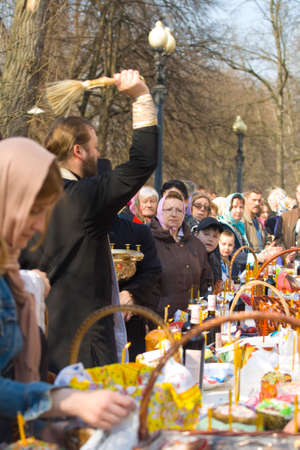 MOSCOW - APRIL 19, 2014: Easter ceremony on church yard, consecration of Easter cakes and eggs.