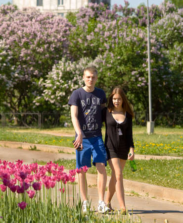 MOSCOW - MAY 16, 2014: people resting in park Lilac garden, garden has been opened in 1954 and has many unique sorts of lilac, selected for this garden and sold all over the world.のeditorial素材
