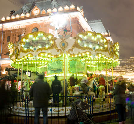 MOSCOW - DECEMBER 21, 2014: carousel on Christmas fair (market) on Theatre square.のeditorial素材