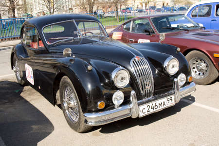 MOSCOW - APRIL 27, 2014: English retro car jaguar on rally of classical cars, organized by Russian Club of Classical Autocars on Theatre square.のeditorial素材
