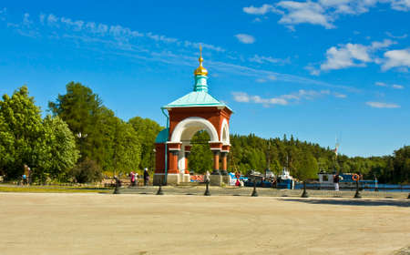VALAAM, RUSSIA - JUNE 16: Island Valaam on Ladoga lake on North of Russia, Saint Nicholas chapel near Transfiguration of Jesus Christ monastery, tourist boats and visitors of monastery in harbour on June 16, 2013 on island Valaam, Russia.のeditorial素材
