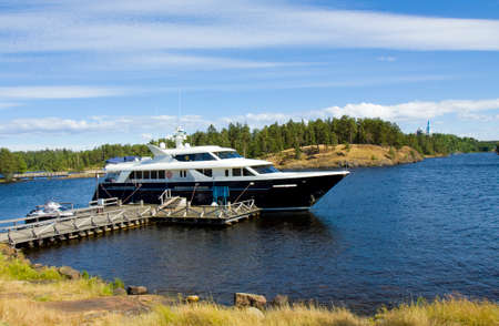 Transfiguration of Jesus Christ monastery on island Valaam on Ladoga lake on North of Russia and little ship.のeditorial素材