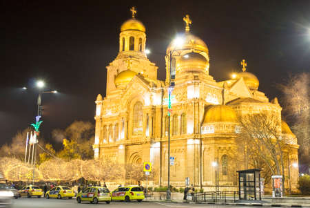 VARNA, BULGARIA - DECEMBER 12, 2015: illumination for Christmas and New Year holidays and Assumption of Virgin Mary cathedral.のeditorial素材