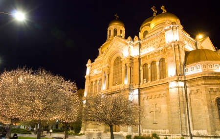 VARNA, BULGARIA - DECEMBER 15, 2015: illumination for Christmas and New Year holidays and Assumption of the Virgin Mary cathedral.のeditorial素材