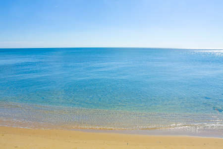 Seascape with calm blue sea, clean blue sky and sandy beach, recorded in Saint Constantine and Saint Helen resort, Bulgaria.の写真素材