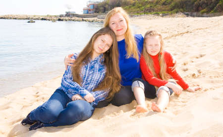 Family mother with two daughters on beach, recorded in Saint Constantine and Helen resort, Bulgaria.