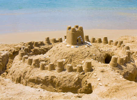 Castle from sand on beach near sea.の写真素材