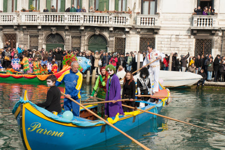 VENICE, ITALY - FEBRAURY 09, 2020: grand opening of carnival with water parade on Canarregio canal.のeditorial素材