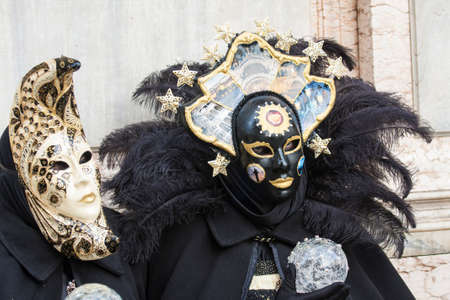 VENICE, ITALY - FEBRAURY 16, 2020: man and woman in carnival cosumes and masks on carnival in Venice.のeditorial素材