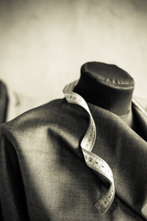 Cloth fabric on tailor mannequin. Concept of clothes atelier workplaceの写真素材