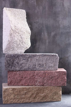 Construction brick  at abstract cement background texture. Construction idea concept