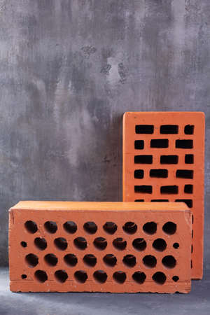 Construction brick  at abstract cement background texture. Construction idea conceptの写真素材