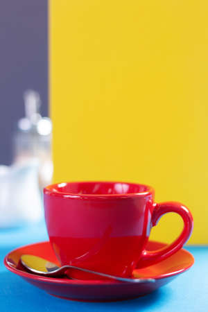 Empty cup of coffee at table. Coffee and colorful background texture. Food and drink minimalism...