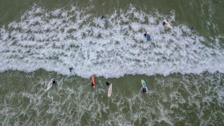 Training day at at Surfer's Corner, Muizenberg, Cape Town, South Africa. Small waves at low tide with a slight off-shore breeze.の写真素材