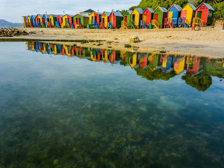 St James tidal pool at low tide on an early spring morning while the beach is being cleaned after a busy weekend.の写真素材