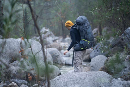 A young smiley man with a backpack .の写真素材