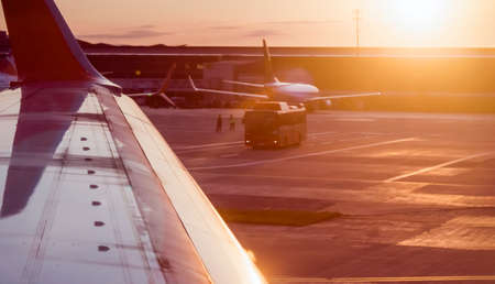 Airplane at sunset on the runway.の写真素材