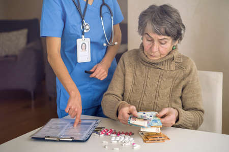 The document is offered by a young woman to a doctor.の写真素材