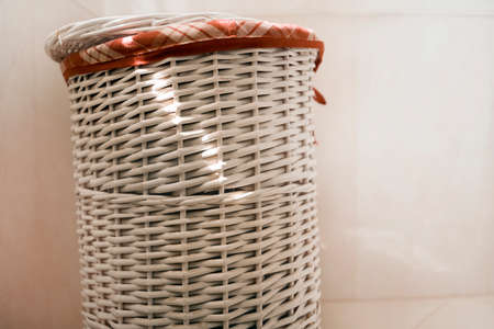 Wooden laundry basket in the bathroom.の写真素材