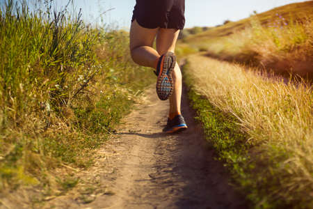 Man is training, running, warming up outdoor.