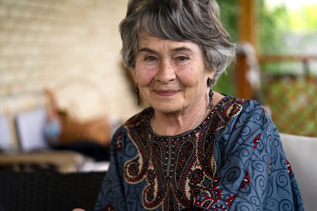 Happy old woman with smiling face closeup view.