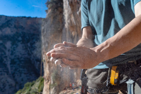 Man climbs with magnesium powder, hands closeup.の写真素材