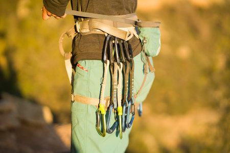 A young girl is engaged in active sports, rock climbing and mountaineering.